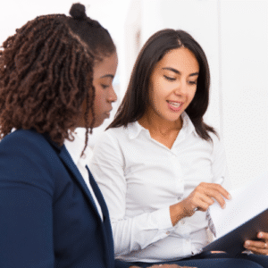 two professional women reviewing a contract